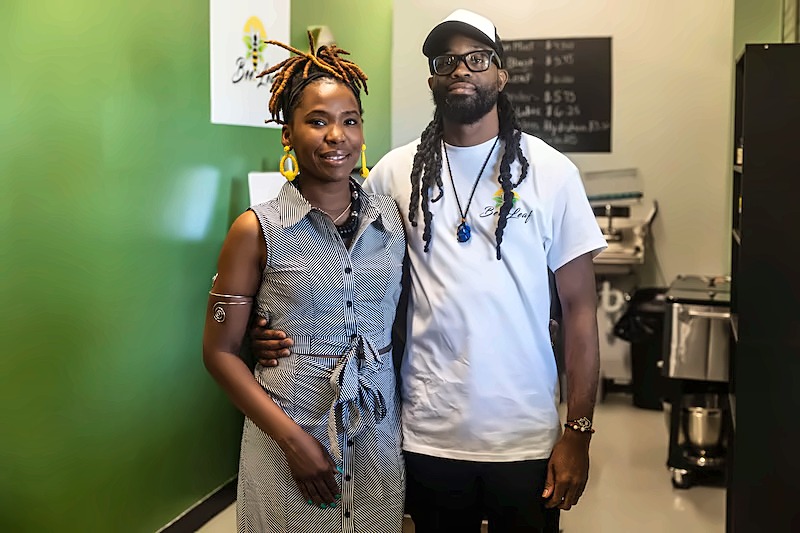 The owners of Bee Leaf standing together inside their Saginaw shop